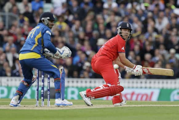 England's Jonathan Trott hits four runs off the bowling of Sri Lanka's Tilakaratne Dilshan during their ICC Champions Trophy cricket match at the Oval cricket ground in London.