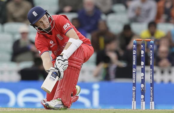 England's Joe Root hits a ball for four runs off the bowling of Sri Lanka's Shaminda Eranga during their ICC Champions Trophy cricket match at the Oval cricket ground in London.