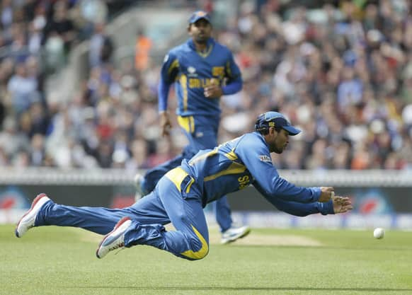 Sri Lanka's Tilakaratne Dilshan fails to catch a shot by England's Joe Root during their ICC Champions Trophy cricket match at the Oval cricket ground in London.