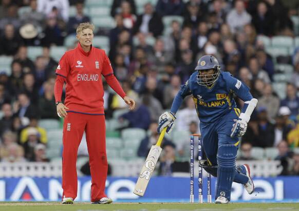 England's bowler Joe Root looks away to the boundary as his teammates fail to stop Sri Lanka' Kumar Sangakkara from scoring four runs during their ICC Champions Trophy cricket match at the Oval cricket ground in London.