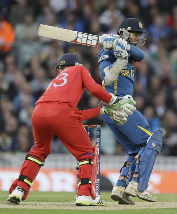 Sri Lanka' Kumar Sangakkara hits two runs off he bowling of England's Graeme Swann during their ICC Champions Trophy cricket match at the Oval cricket ground in London.