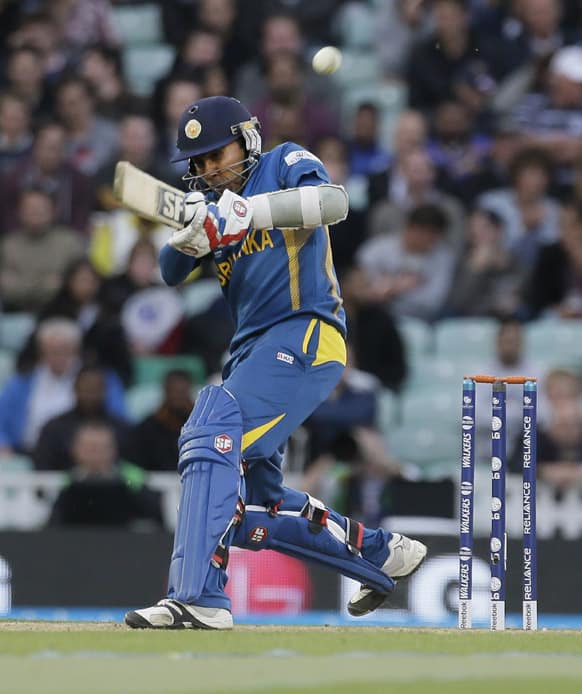 Sri Lanka's Mahela Jayawardena hits a ball bowled by England's James Anderson, that is caught on the boundary by a substitute fielder during their ICC Champions Trophy cricket match at the Oval cricket ground in London.