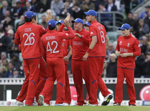 Players from the England team celebrate after taking the wicket of Sri Lanka's Mahela Jayawardena during their ICC Champions Trophy cricket match at the Oval cricket ground in London.