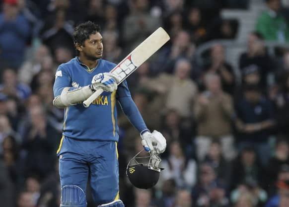 Sri Lanka's Kumar Sangakkara celebrates reaching his century against England during their ICC Champions Trophy cricket match at the Oval cricket ground in London.