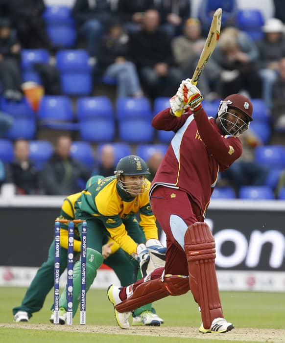 West Indies' Chris Gayle plays a shot off the bowling of South Africa's Jean-Paul Duminy during an ICC Champions Trophy cricket match between West Indies and South Africa at the Cardiff Wales Stadium in Cardiff.