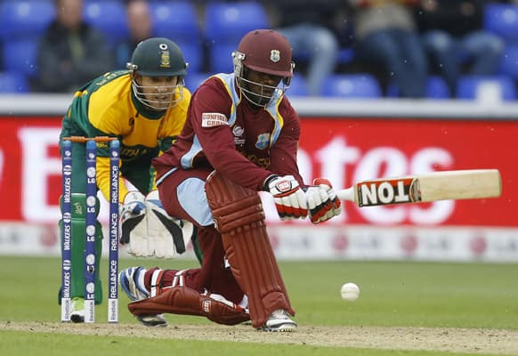 West Indies' Devon Smith plays a shot off the bowling of South Africa's Robin Peterson during an ICC Champions Trophy cricket match between West Indies and South Africa at the Cardiff Wales Stadium in Cardiff.