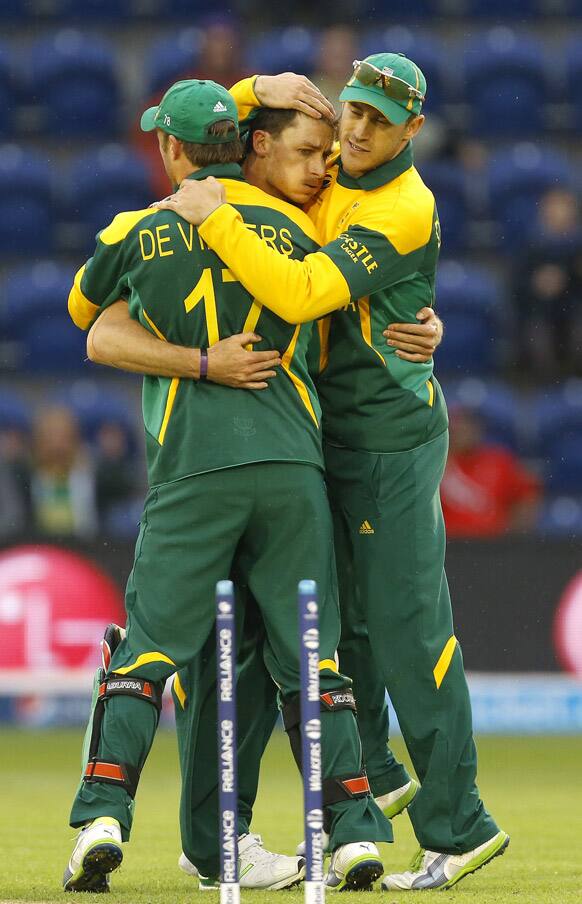 South Africa's Dale Steyn is congratulated after bowling West Indies' Marlon Samuels during an ICC Champions Trophy cricket match between West Indies and South Africa at the Cardiff Wales Stadium in Cardiff.