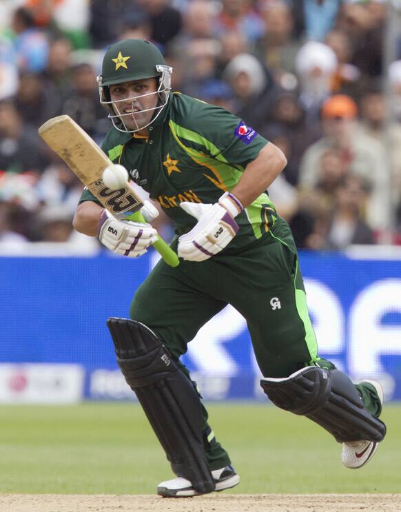 Pakistan's Kamran Akmal plays a shot off the bowling of India's Bhuvneshwar Kumar, during their ICC Champions Trophy cricket match at Edgbaston cricket ground, Birmingham, England.