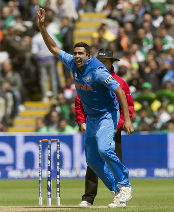 Ravichandran Ashwin celebrates after taking the wicket of Pakistan's Kamran Akmal for 21 during their ICC Champions Trophy cricket match at Edgbaston cricket ground, Birmingham, England.