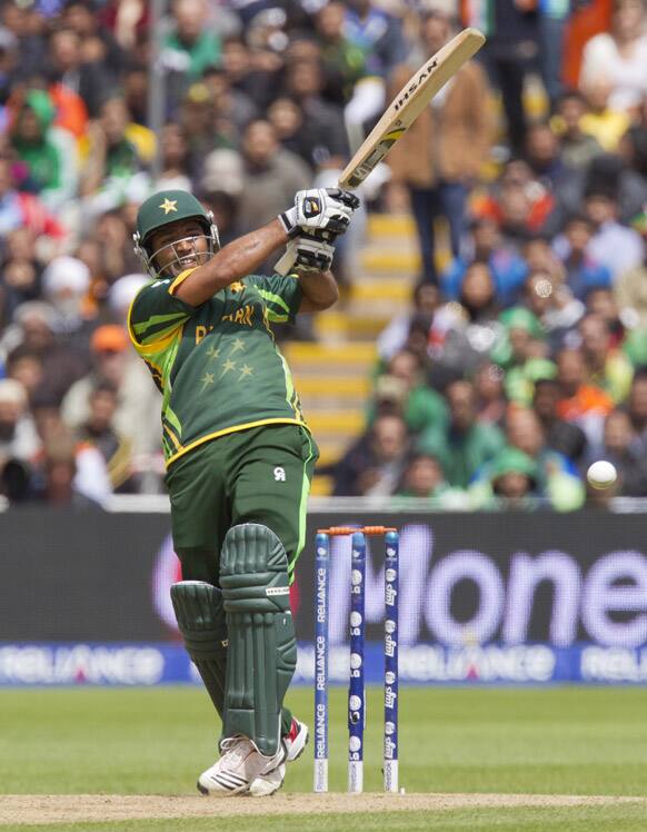 Pakistan's Asad Shafiq hits a four off the bowling of India's Umesh Yadav during their ICC Champions Trophy cricket match at Edgbaston cricket ground, Birmingham, England.