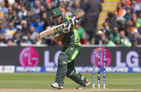 Pakistan's Asad Shafiq hits a shot off the bowling of India's Umesh Yadav during their ICC Champions Trophy cricket match at Edgbaston cricket ground, Birmingham, England.