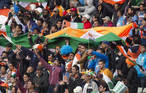 India supporters celebrate as their team beat Pakistan by 8 wickets during their ICC Champions Trophy cricket match at Edgbaston cricket ground, Birmingham.