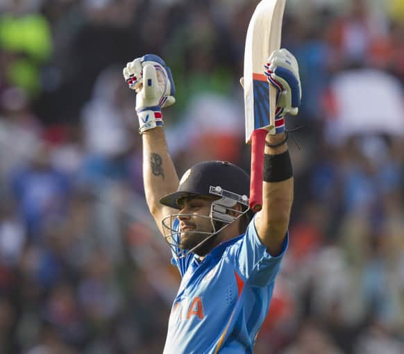 Virat Kohli celebrates as his side beat Pakistan during their ICC Champions Trophy cricket match at Edgbaston cricket ground, Birmingham.