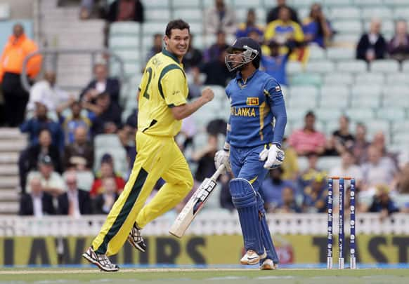 Kumar Sangakkara, right, begins to walk off the pitch after being given out caught by Australia' Glenn Maxwell, off the bowling of Clint McKay who is seen reacting, left, during their ICC Champions Trophy cricket match at the Oval cricket ground in London.