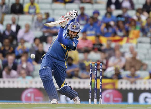 Sri Lanka' Lahiru Thirimanne hits a ball bowled by Australia's Clint McKay during their ICC Champions Trophy cricket match at the Oval cricket ground in London.