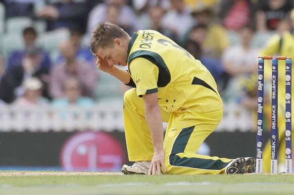 Australia's Xavier Doherty puts his hand to his head after bowling to Sri Lanka's Mahela Jayawardena during their ICC Champions Trophy cricket match at the Oval cricket ground in London.