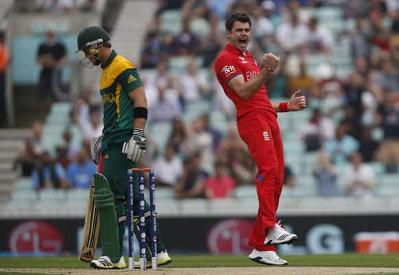 England's James Anderson, right, celebrates the wicket of South Africa's Colin Ingram, left, by lbw during their ICC Champions Trophy semifinal cricket match at the Oval cricket ground in London.