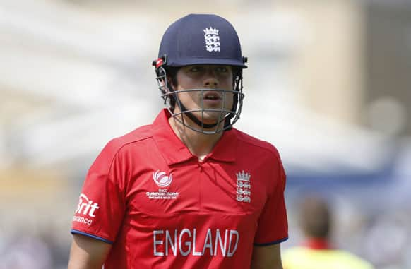 England's Alastair Cook walks off the crease caught by South Africa's AB de Villiers from the bowling of Chris Morris during their ICC Champions Trophy semifinal cricket match at the Oval cricket ground in London.