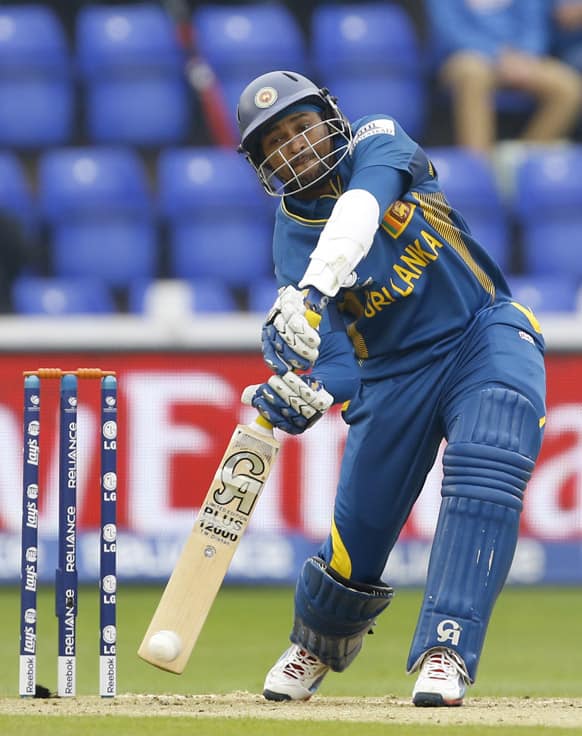 Sri Lanka's Tilakaratne Dilshan plays a shot off the bowling of India's Umesh Yadav during an ICC Champions Trophy semifinal between India and Sri Lanka at the Cardiff Wales Stadium in Cardiff.