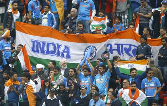 India fans watch the cricket during an ICC Champions Trophy semifinal between India and Sri Lanka at the Cardiff Wales Stadium in Cardiff.