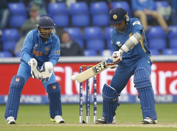 Sri Lanka's Mahela Jayawardena plays a shot off the bowling of India's MS Dhoni during an ICC Champions Trophy semifinal between India and Sri Lanka at the Cardiff Wales Stadium in Cardiff.