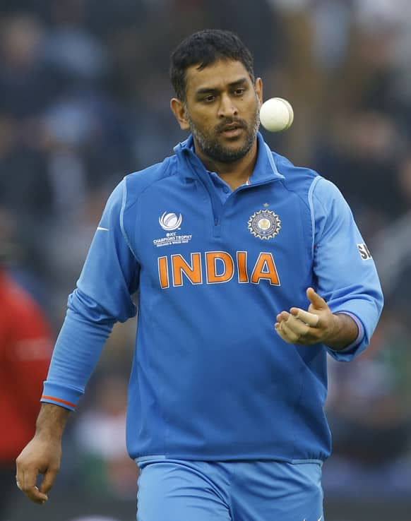 MS Dhoni prepares to bowl during the ICC Champions Trophy semifinal between India and Sri Lanka at the Cardiff Wales Stadium in Cardiff.