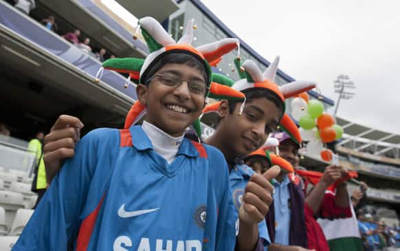 India fans wait for play for play before the team's ICC Champions Trophy Final cricket match against England at Edgbaston cricket ground, Birmingham..