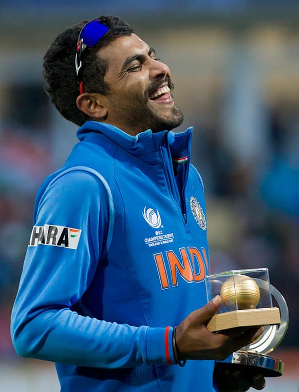 India's Ravindra Jadeja laughs after winning the golden ball and man of the match award after his side's win by 5 runs over England in the ICC Champions Trophy Final cricket match at Edgbaston cricket ground, Birmingham.