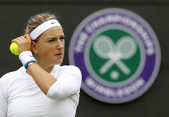 Victoria Azarenka of Belarus prepares to serve to Maria Joao Koehler of Portugal during their Women's first round singles match at the All England Lawn Tennis Championships in Wimbledon.