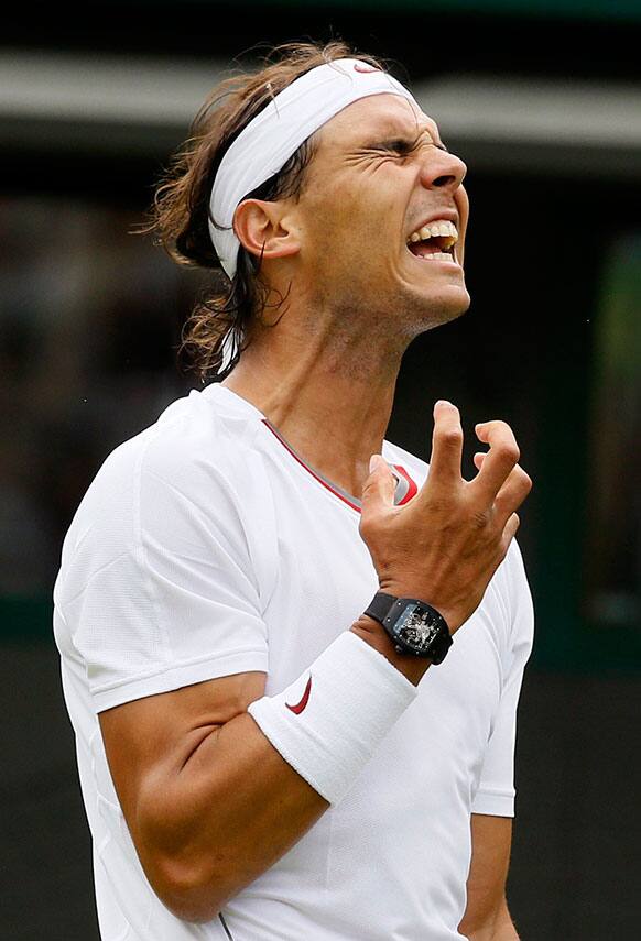 Rafael Nadal of Spain reacts as he loses a point to Steve Darcis of Belgium during their Men's first round singles match at the All England Lawn Tennis Championships in Wimbledon.