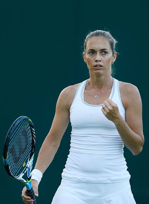 Klara Zakopalova of the Czech Republic reacts after winning a point against Daniela Hantuchova of Slovakia in their Women's first round singles match at the All England Lawn Tennis Championships in Wimbledon.