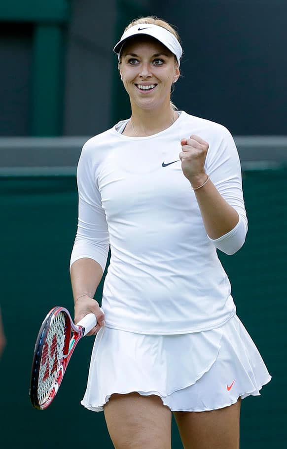 Sabine Lisicki of Germany reacts as she defeats Francesca Schiavone of Italy in their Women's first round singles match at the All England Lawn Tennis Championships in Wimbledon.