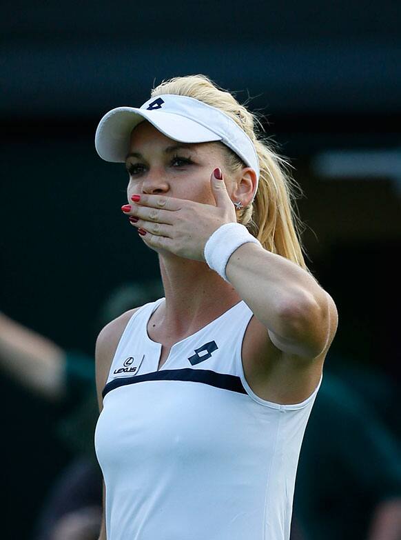 Agnieszka Radwanska of Poland blows a kiss after defeating Yvonne Meusburger of Austria in their Women's first round singles match at the All England Lawn Tennis Championships in Wimbledon.