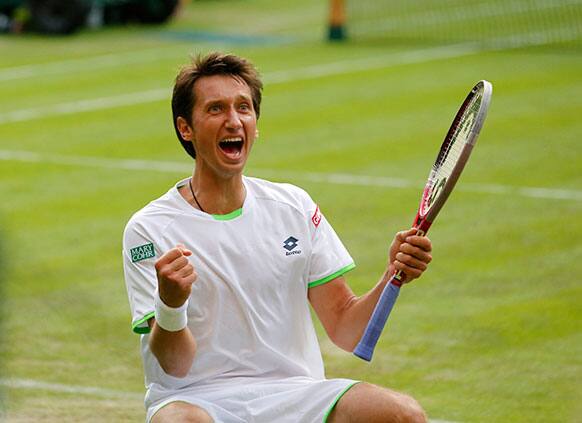 Sergiy Stakhovsky of Ukraine reacts as he wins against Roger Federer of Switzerland in their Men's second round singles match at the All England Lawn Tennis Championships in Wimbledon.