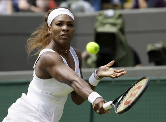 Serena Williams of the United States plays a return to Caroline Garcia of France in their Women's second round singles match at the All England Lawn Tennis Championships in Wimbledon.