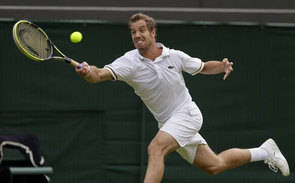 Richard Gasquet of France returns to Go Soeda of Japan during their Men's second round singles match at the All England Lawn Tennis Championships in Wimbledon.