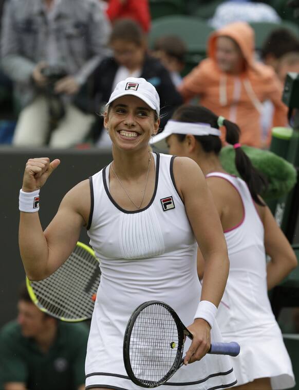 Marina Erakovic of New Zealand celebrates after beating Peng Shuai of China during their Women's second round singles match at the All England Lawn Tennis Championships in Wimbledon.