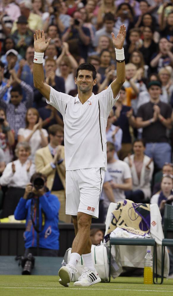 Novak Djokovic of Serbia reacts after defeating Bobby Reynolds of the United States in their Men's second round singles match at the All England Lawn Tennis Championships in Wimbledon, London.