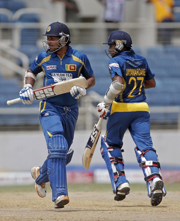 Sri Lanka batsmen Kumar Sangakkara, left, and Mahela Jayawardene run between the wickets during the Tri-Nation Series cricket match against West Indies in Kingston, Jamaica.