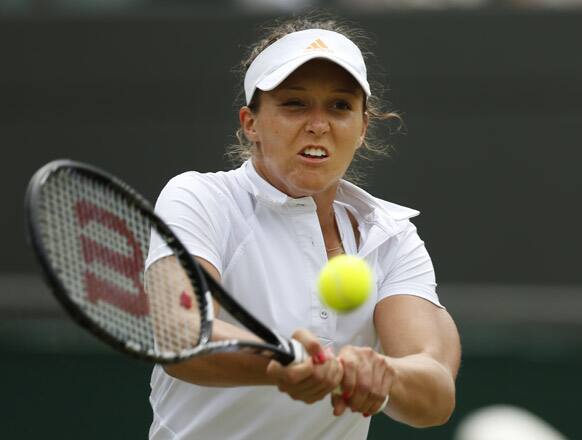 Laura Robson of Britain returns to Kaia Kanepi of Estonia during a Women's singles match at the All England Lawn Tennis Championships in Wimbledon.