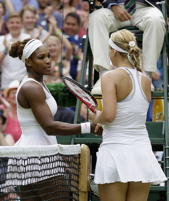 Sabine Lisicki of Germany greets Serena Williams of the United States at the net after winning their Women's singles match at the All England Lawn Tennis Championships in Wimbledon.