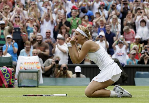 Sabine Lisicki of Germany reacts after beating Serena Williams of the United States in a Women's singles match at the All England Lawn Tennis Championships in Wimbledon.