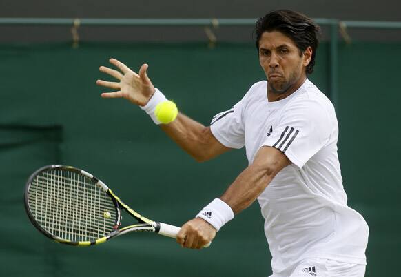 Fernando Verdasco of Spain returns to Kenny De Schepper of France in a Men's singles match at the All England Lawn Tennis Championships in Wimbledon, London.