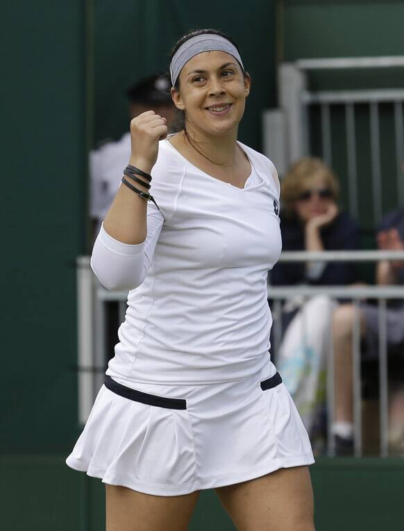 Marion Bartoli of France celebrates after beating Karin Knapp of Italy during their Women's singles match at the All England Lawn Tennis Championships in Wimbledon.