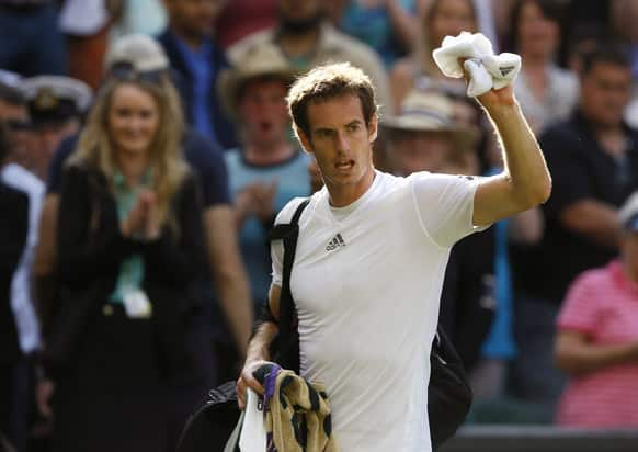 Andy Murray of Britain waves to spectators after defeating Mikhail Youzhny of Russia in a Men's singles match at the All England Lawn Tennis Championships in Wimbledon.