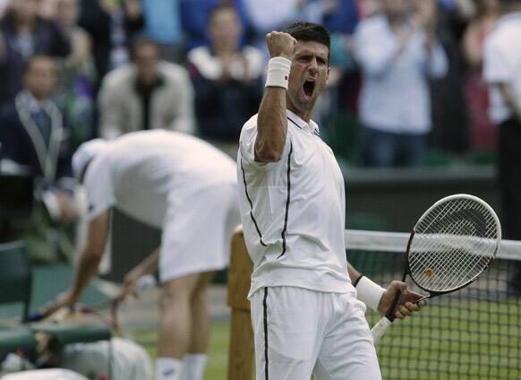 Novak Djokovic of Serbia reacts after defeating Tommy Haas of Germany during a Men's singles match at the All England Lawn Tennis Championships in Wimbledon.