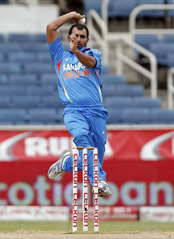 India's Shami Ahmed bowls during the Tri-Nation Series cricket match against Sri Lanka in Kingston, Jamaica.