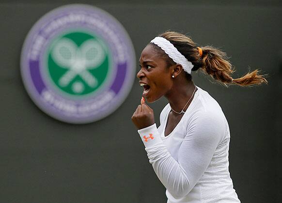 Sloane Stephens of the United States reacts after winning a game during a Women's singles quarterfinal match against Marion Bartoli of France at the All England Lawn Tennis Championships in Wimbledon.