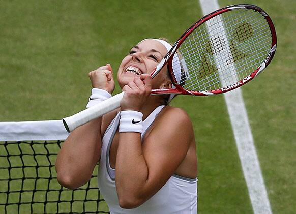 Sabine Lisicki of Germany reacts as she wins a Women's singles quarterfinal match against Kaia Kanepi of Estonia at the All England Lawn Tennis Championships in Wimbledon.