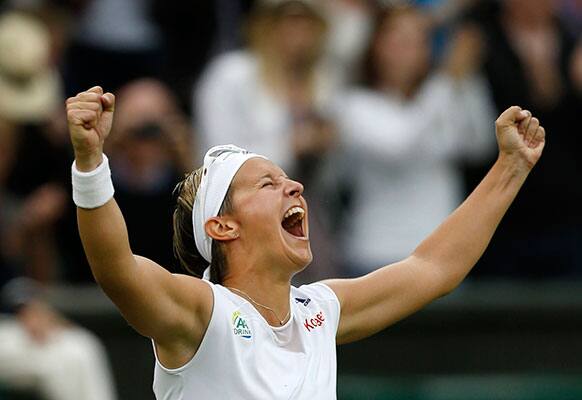 Kirsten Flipkens of Belgium reacts after defeating Petra Kvitova of the Czech Republic in a Women's singles quarterfinal match at the All England Lawn Tennis Championships in Wimbledon.